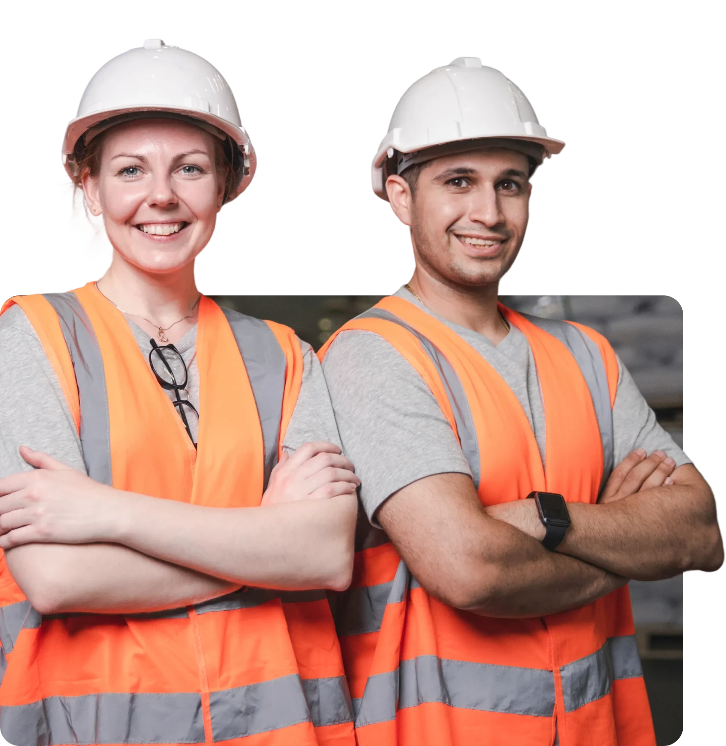 Two construction workers in safety gear smiling.