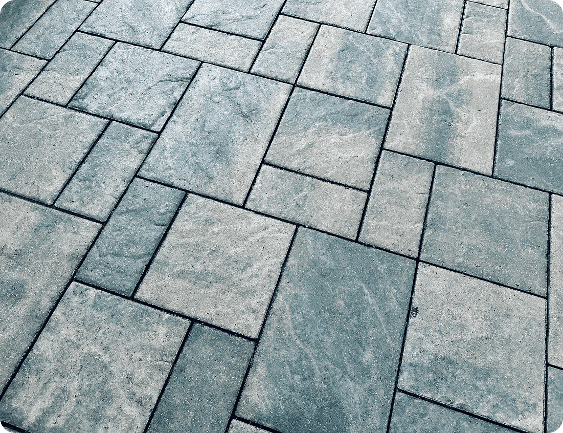 Patterned stone pavement with geometric design.
